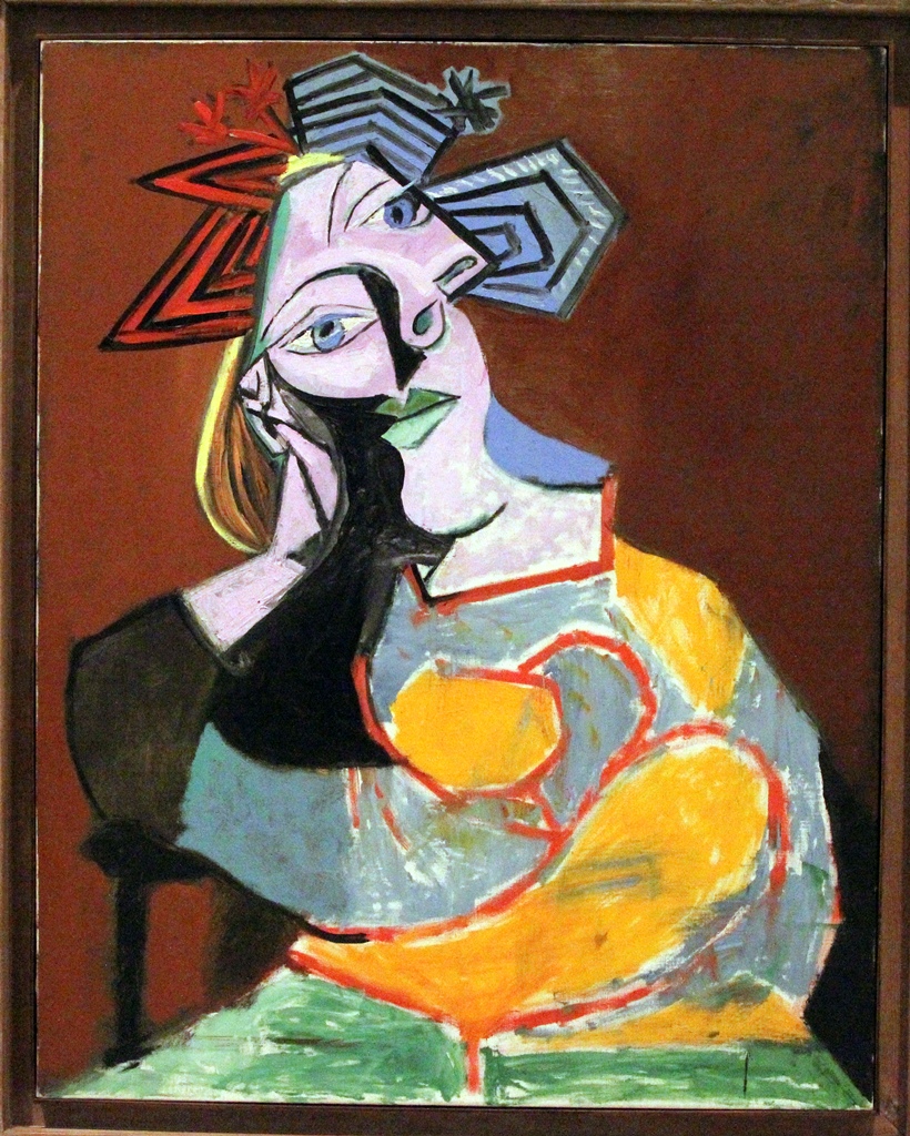 Seated Woman Resting on Elbows