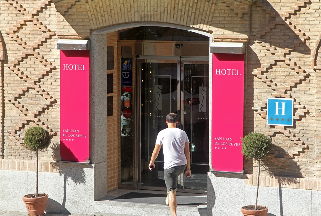 Philip Entering Hotel