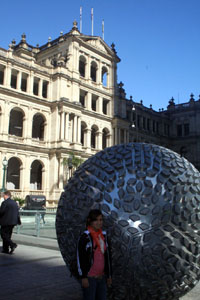 Connie with Treasury Building and Sculpture