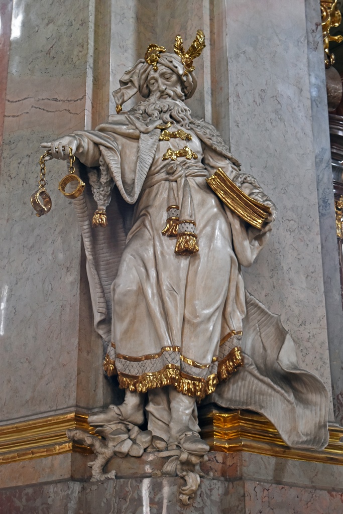 Statue Holding Manacles and Book